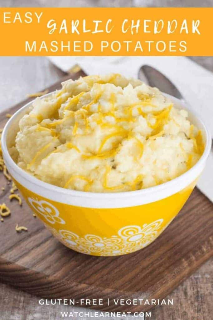 pin showing mashed potatoes in a yellow bowl with white flower designs on it