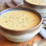 close-up of soup in a rustic bowl with another one partially in view behind it