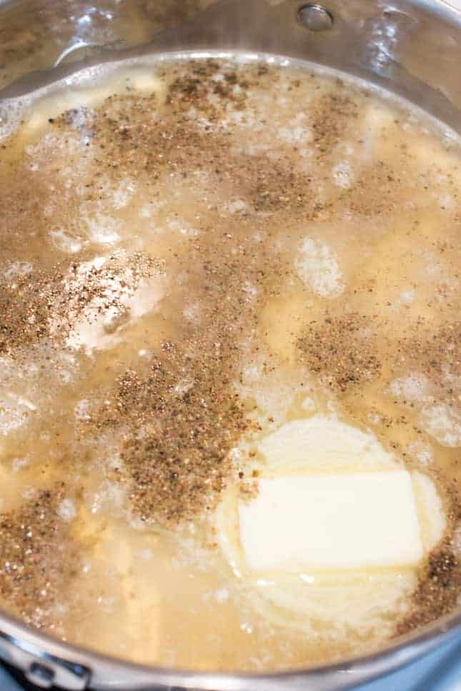 broth, pepper and butter in sauté pan