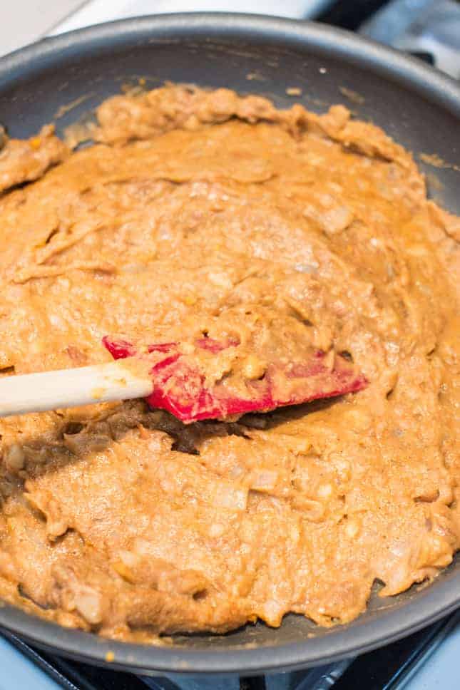 refried beans cooking in skillet