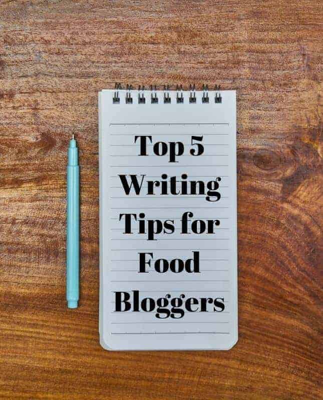 Notebook with the words Top 5 Writing Tips for Food Bloggers and a pen next to it