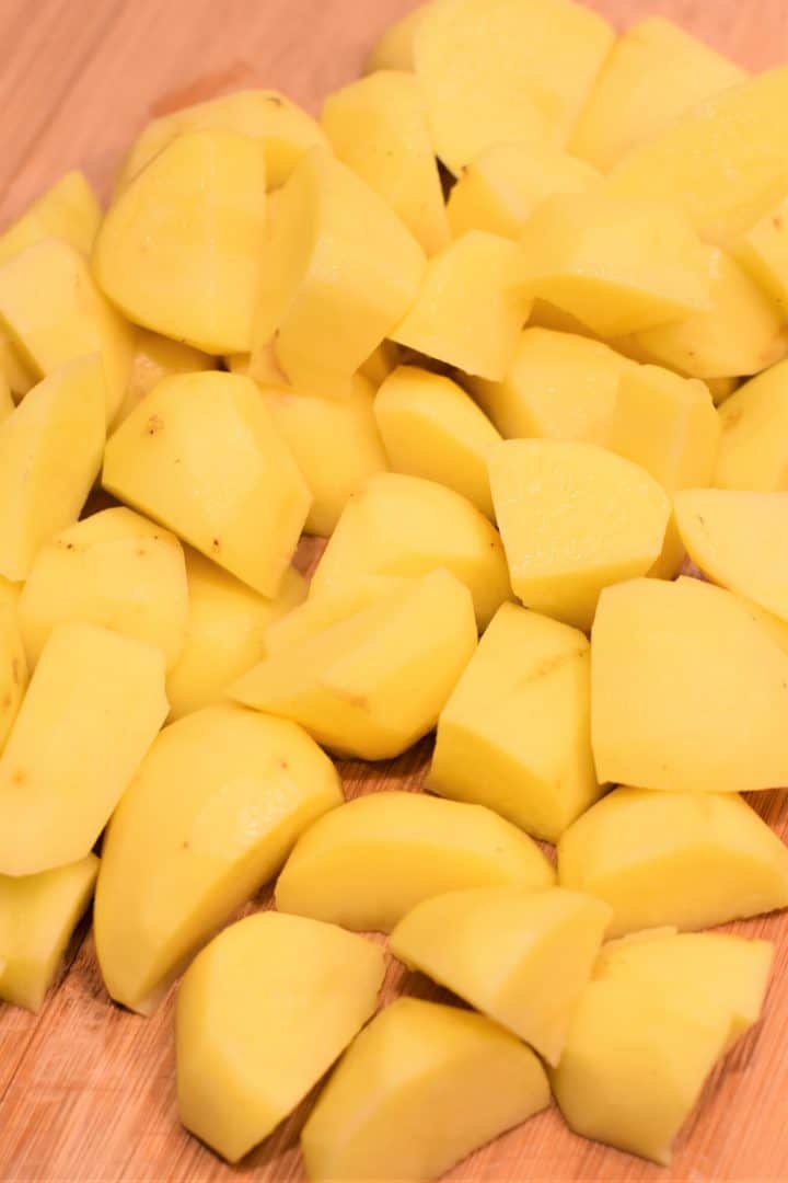 potatoes chopped on a wooden cutting board