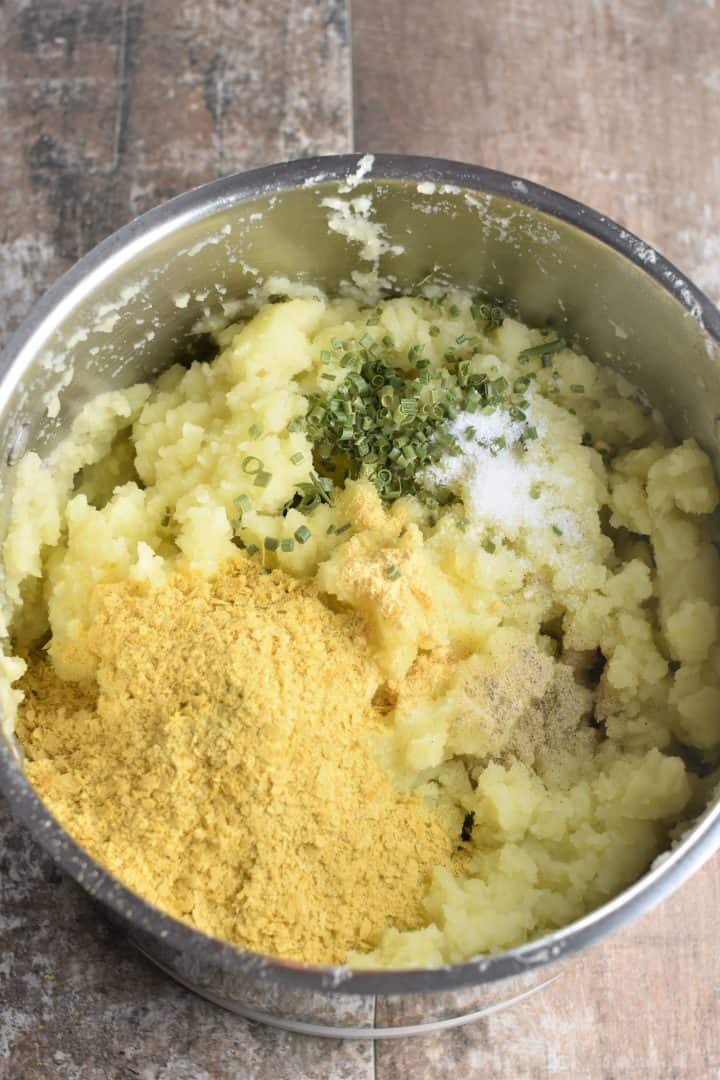 nutritional yeast, chives, salt and white pepper added to potatoes