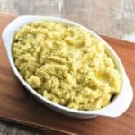 overhead of mashed potatoes in white oval serving dish