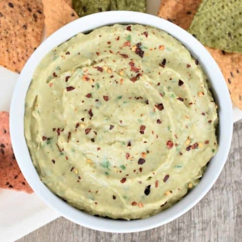 Overhead view of hummus in a white bowl