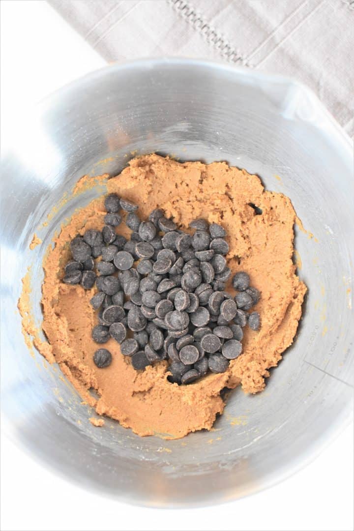 chocolate chips added to dough in mixing bowl