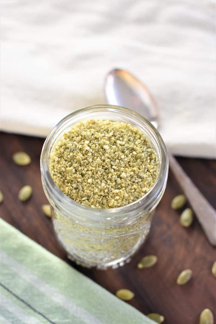 slight overhead of vegan Parmesan cheese in mason jar 