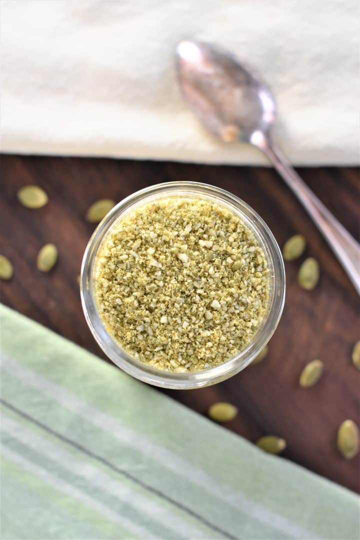 overhead of pumpkin seed cheese in mason jar