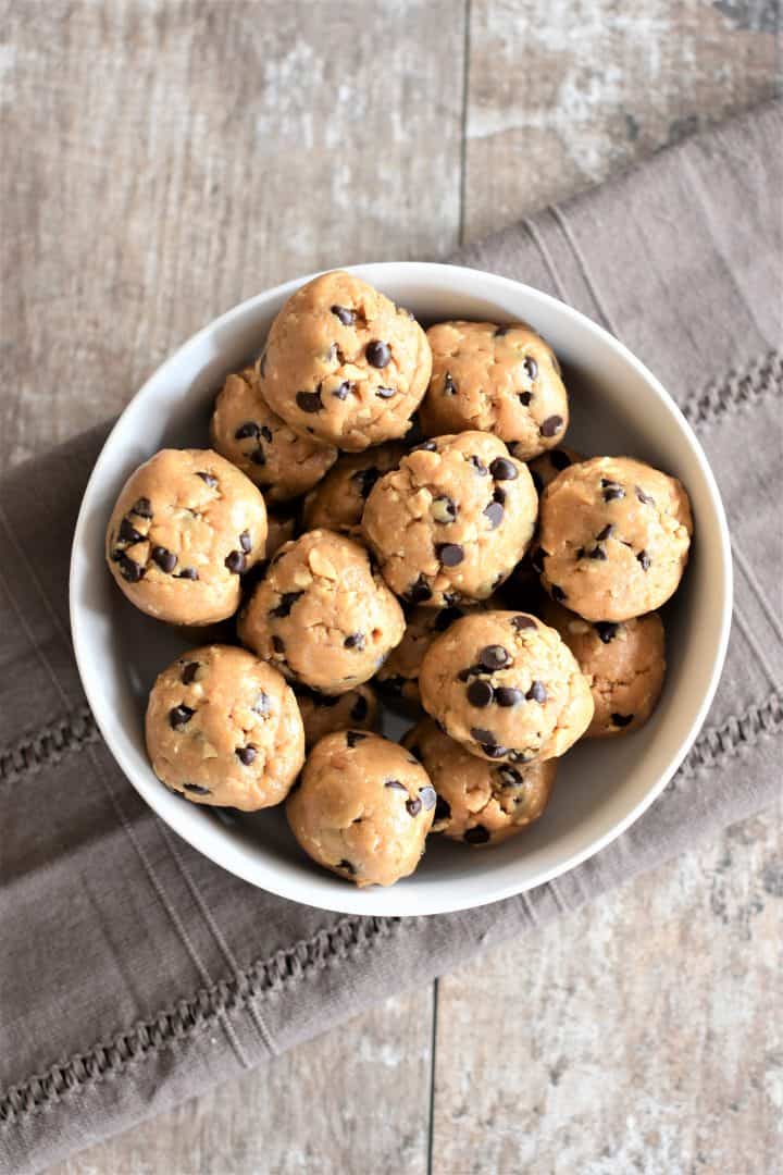 overhead of peanut butter balls in a white bowl