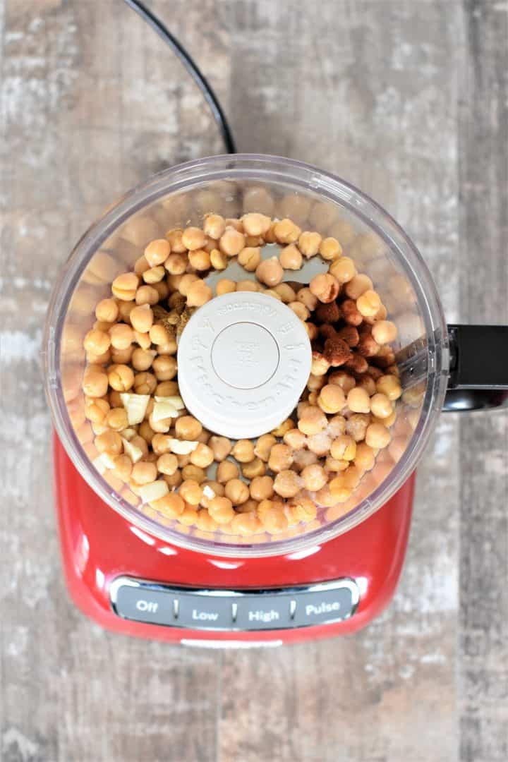 Chickpeas, garlic, cumin, paprika, salt and lemon juice in a food processor