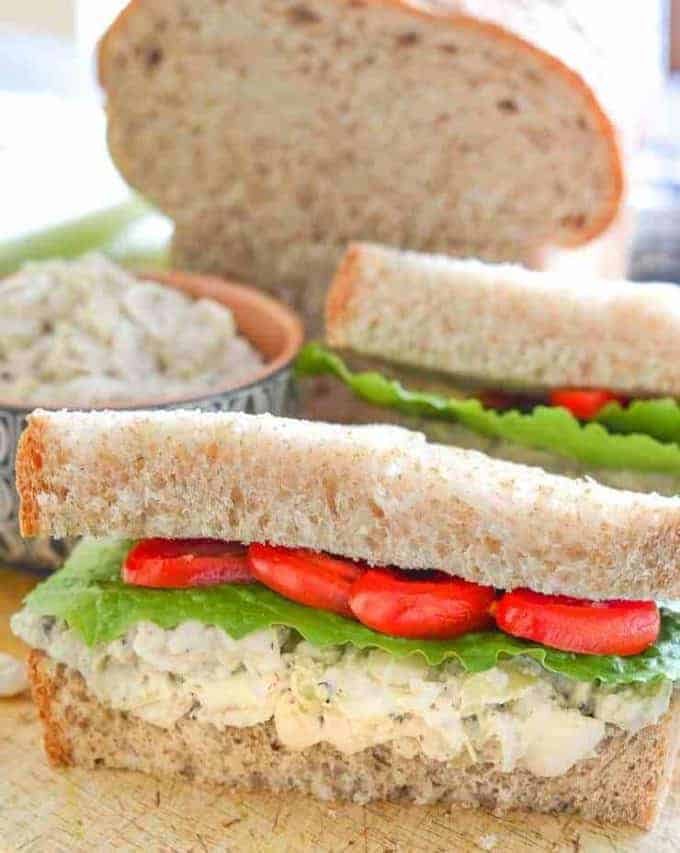 white bean sandwich open on a cutting board