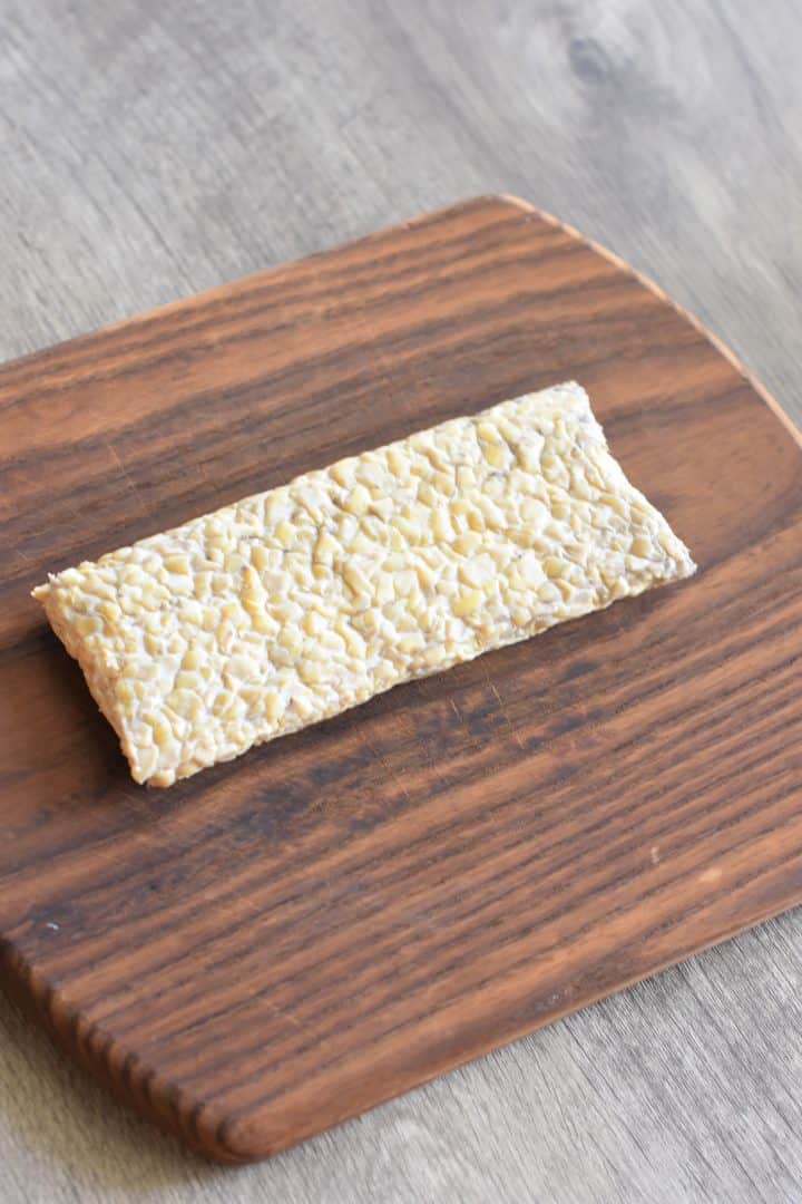 tempeh block on a cutting board