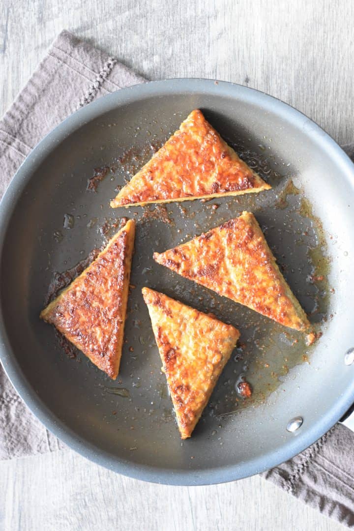 sauteeing tempeh in a skillet