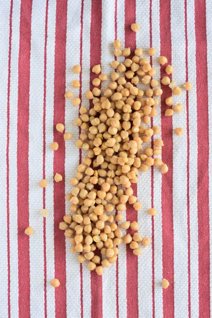 Chickpeas in a pile on a kitchen towel