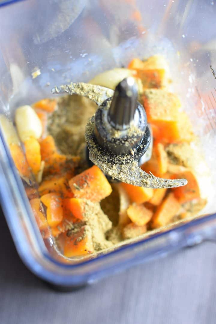 Ingredients for butternut squash sauce in blender getting ready to be pureed