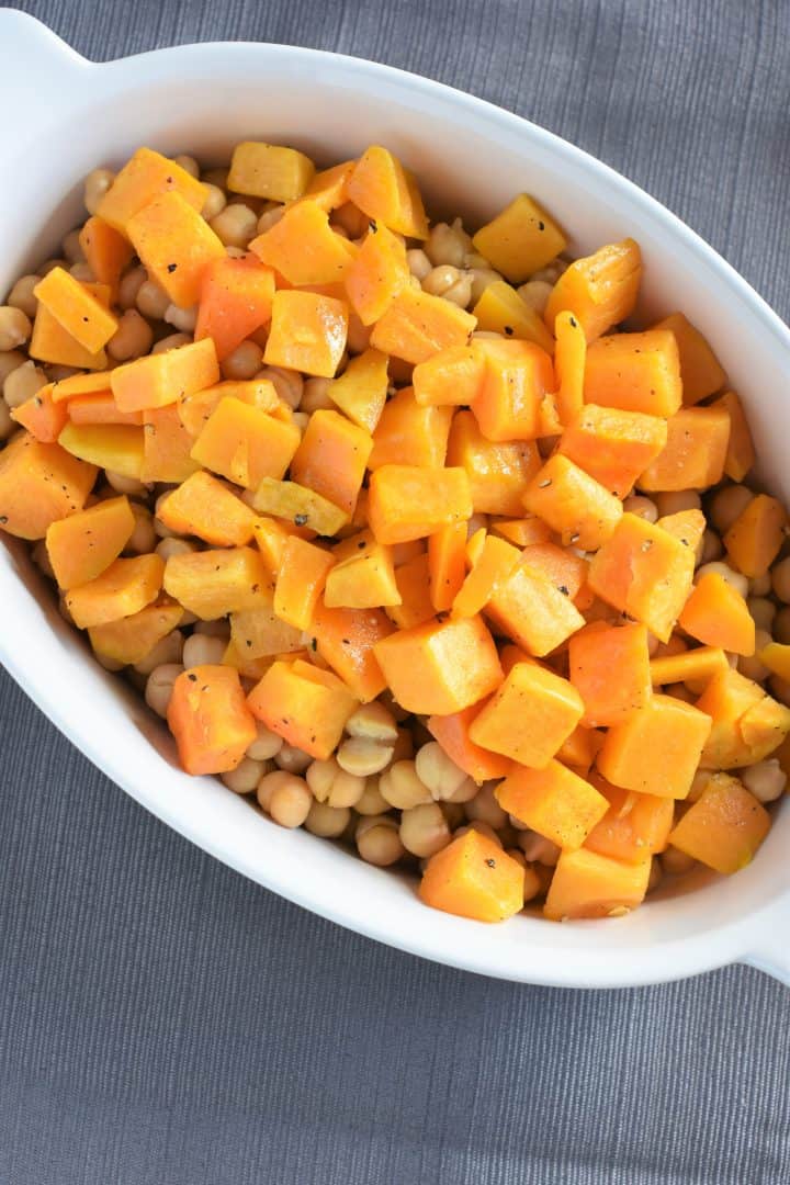 Chickpeas and cooked butternut squash in casserole dish