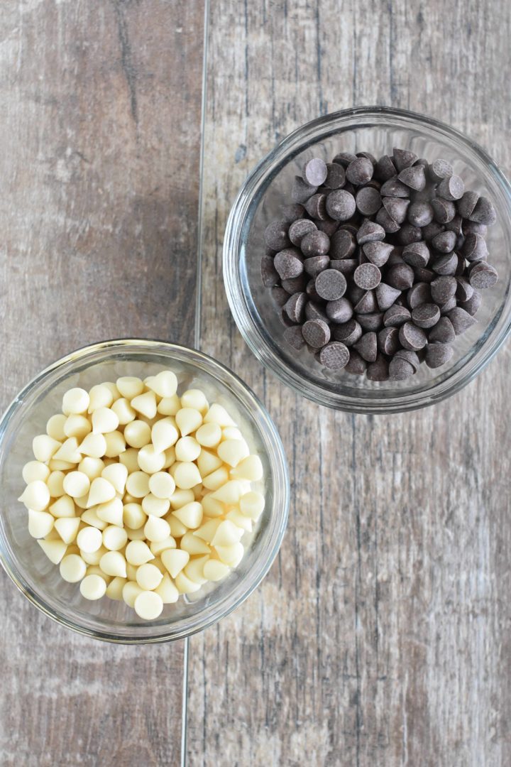 dark and white chocolate chips in small glass bowls