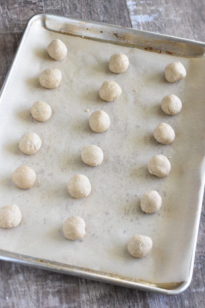 dough balls on parchment-lined baking sheet