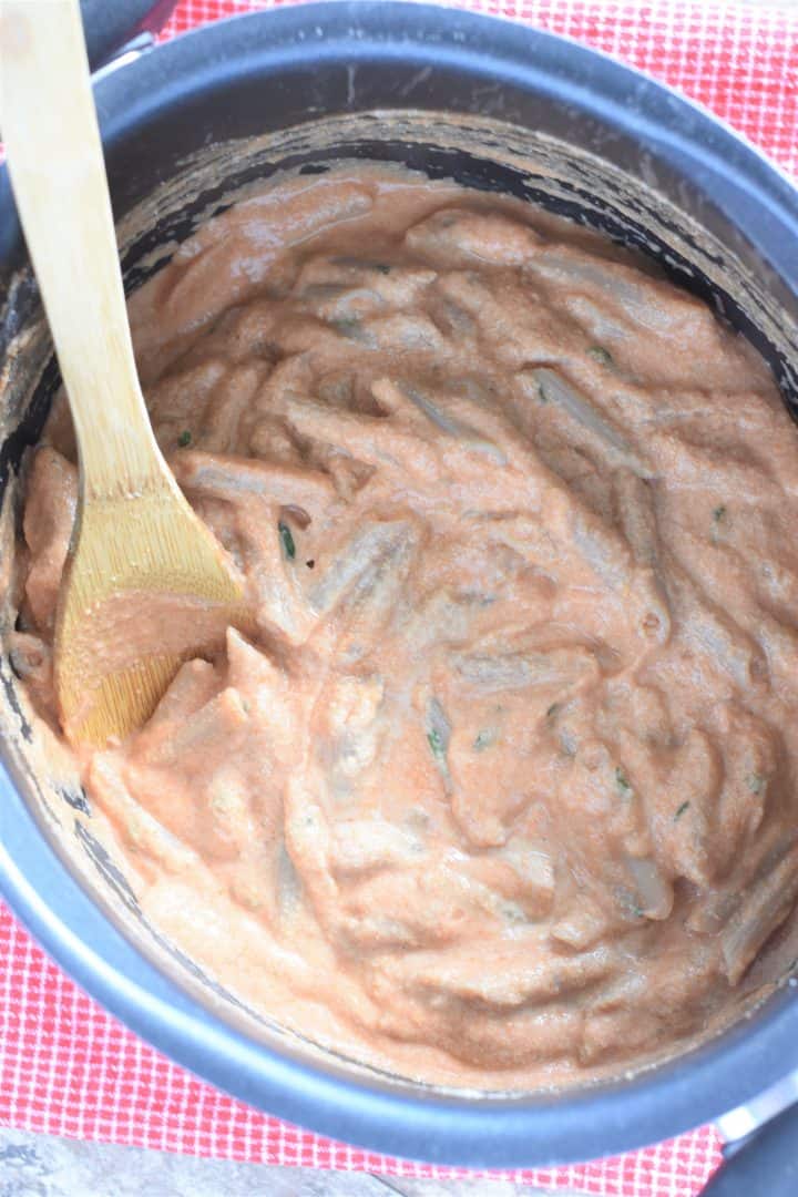 Sauce and ricotta added to the cooked pasta in the pot