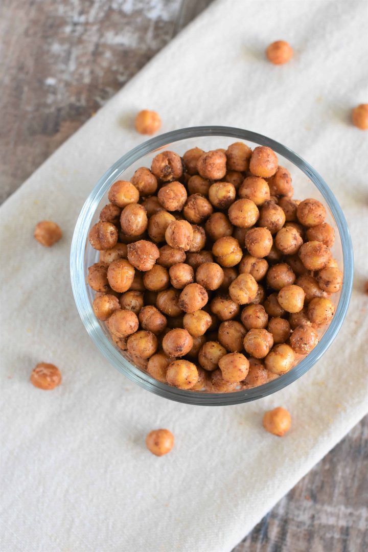 Taco fiesta chickpeas in bowl on kitchen towel with some on the towel