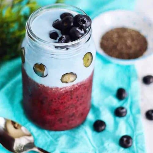 triple berry smoothie with blueberries on top.