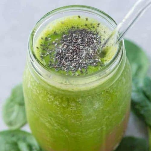 alkaline smoothie in a mason jar with a clear straw.