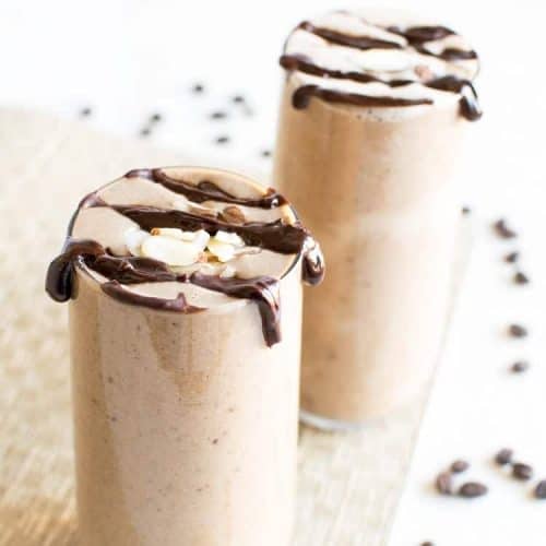 chocolate mocha protein smoothie in two glasses.