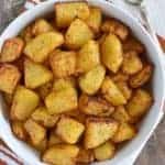 overhead of breakfast potatoes in a white bowl