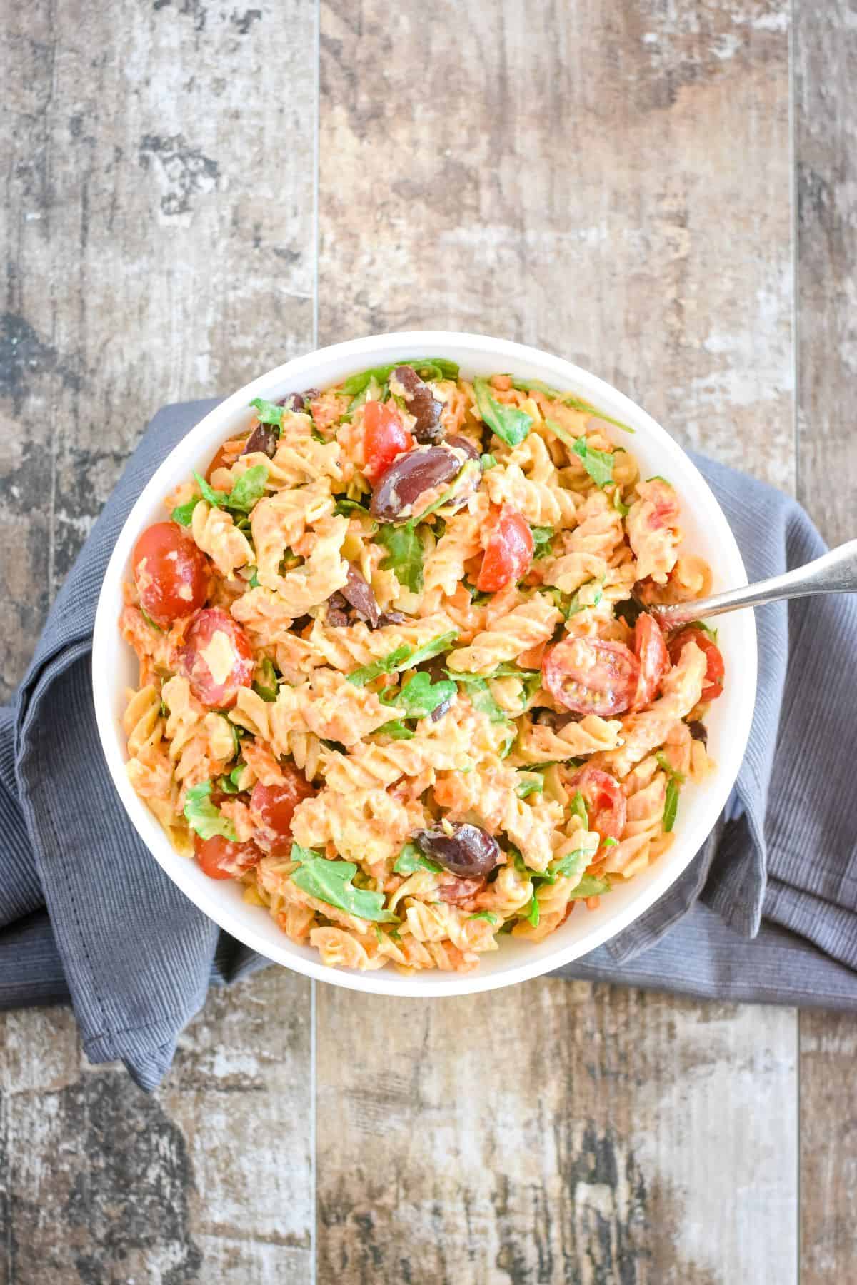 overhead of pasta salad in a bowl with a spoon in it.