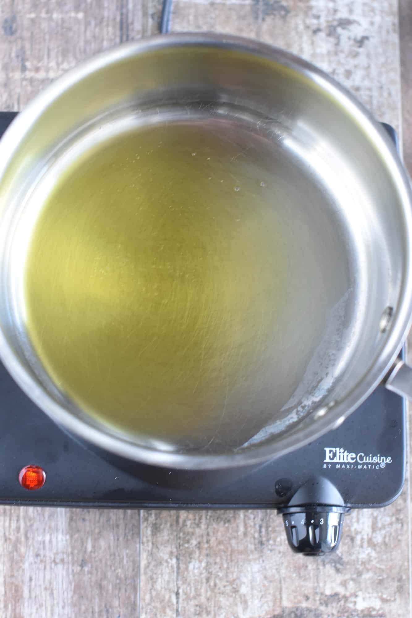 Heating olive oil in saucepan