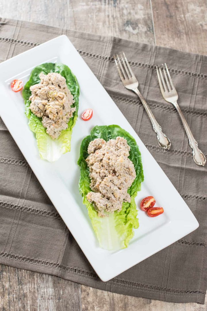 chickpea salad on lettuce wraps on a white serving platter
