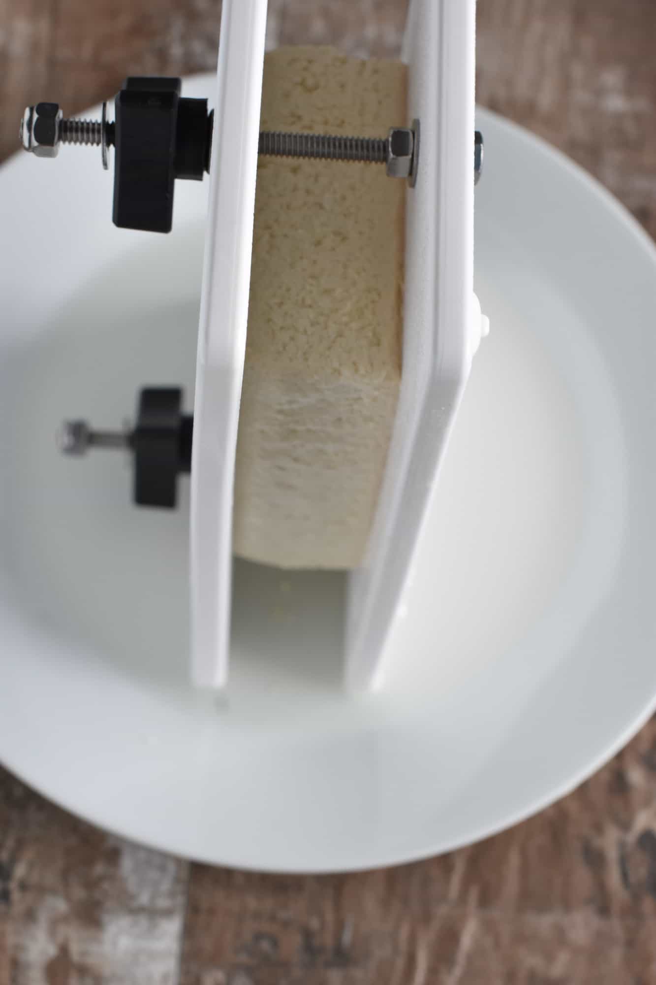 pressing tofu with a tofu press