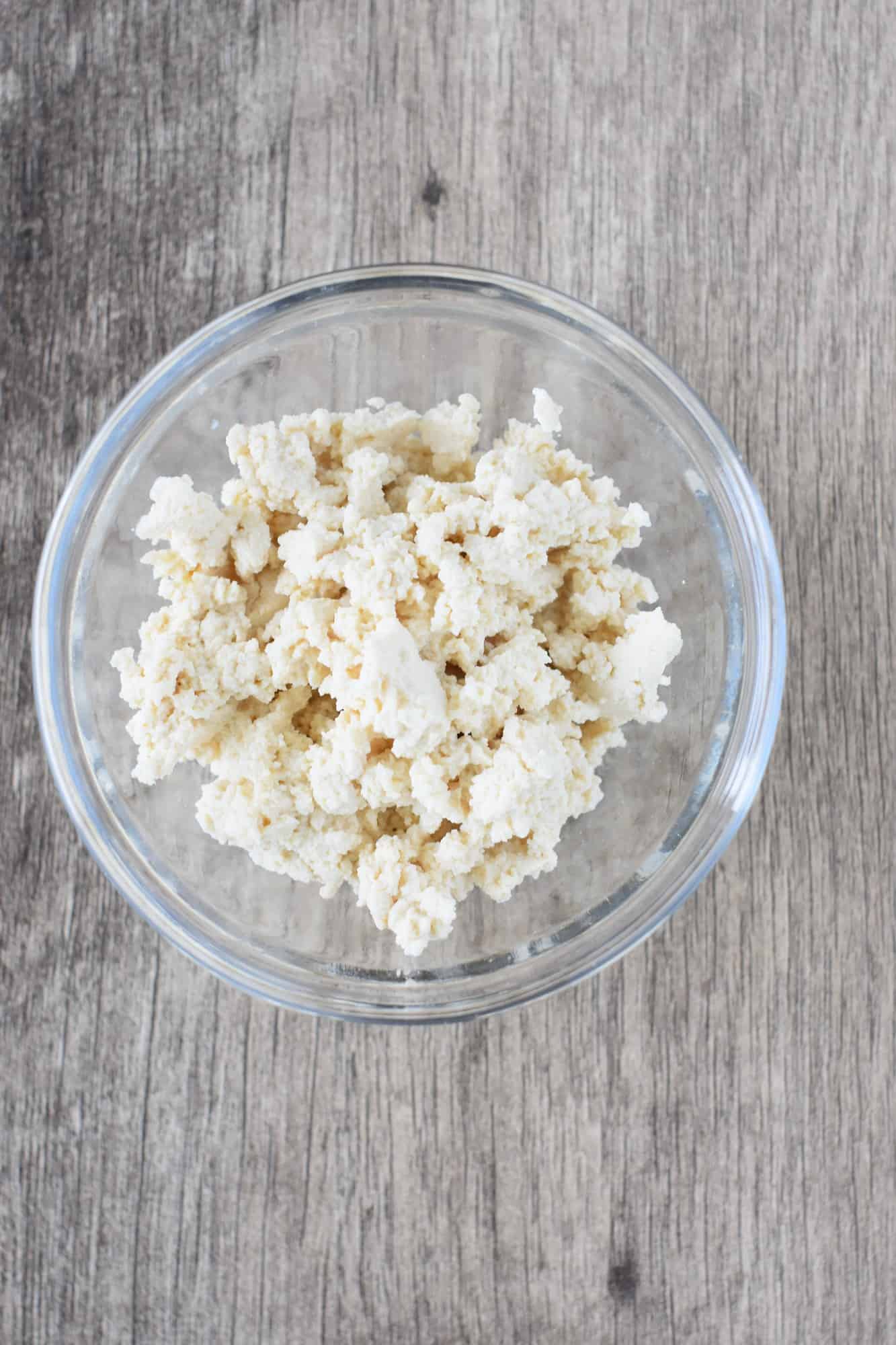 crumbled tofu in a small glass bowl