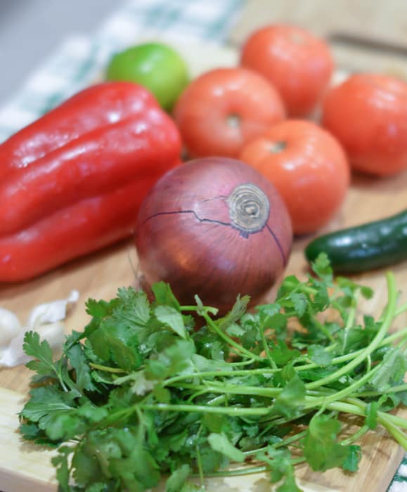 Ingredients for salsa on a cutting board