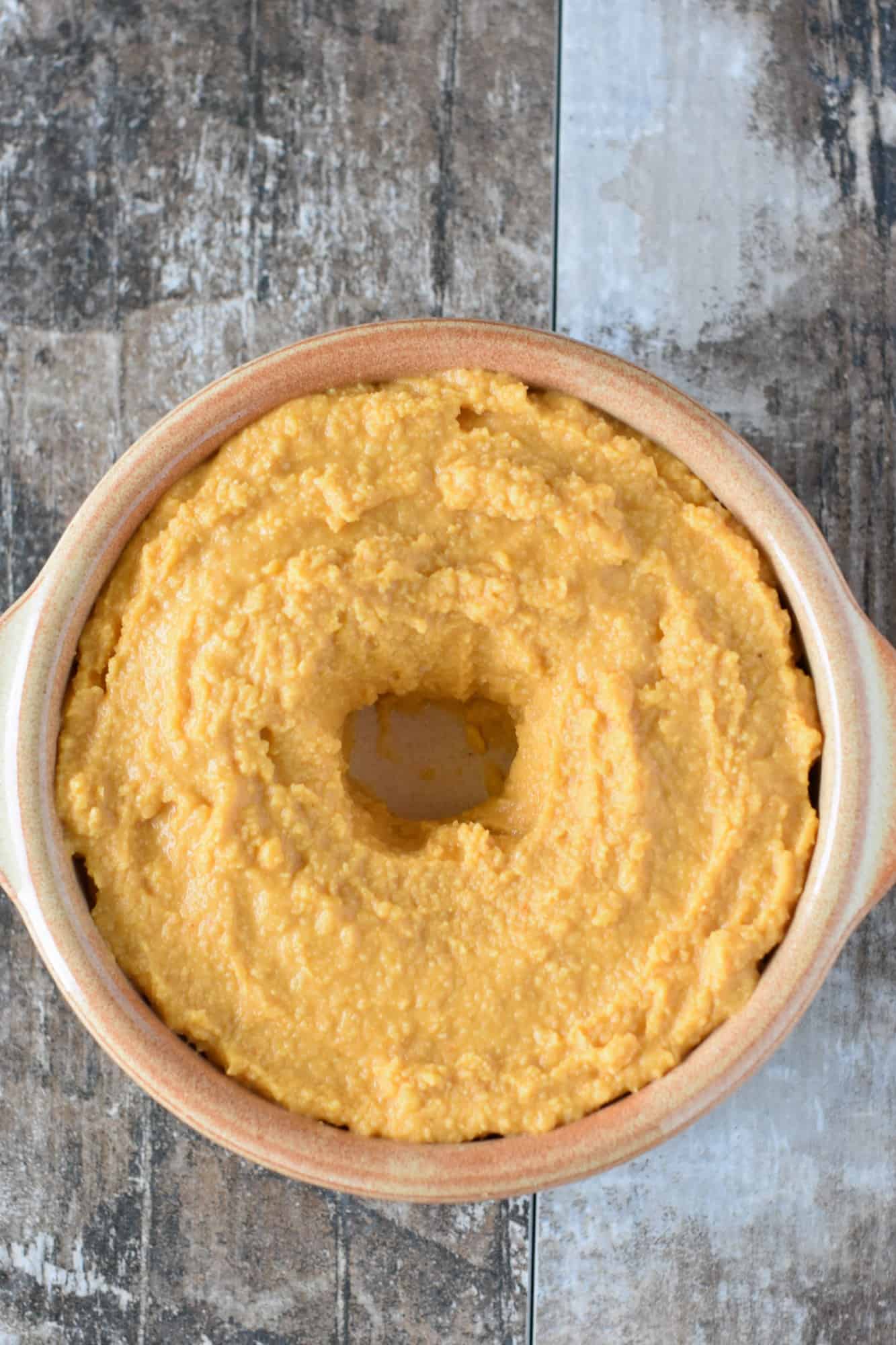 hummus in serving bowl with well in the middle