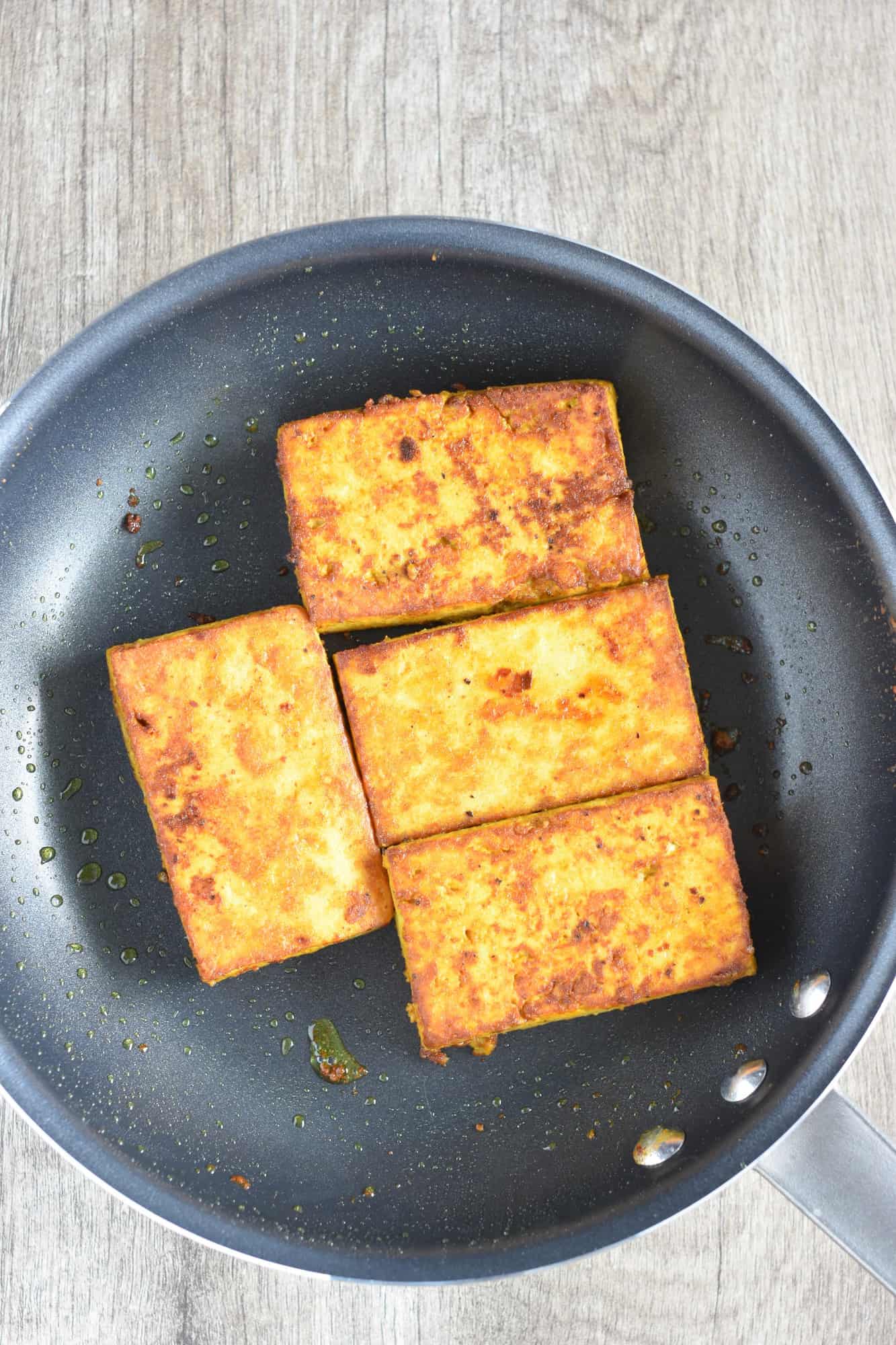 cooked tofu in a nonstick pan