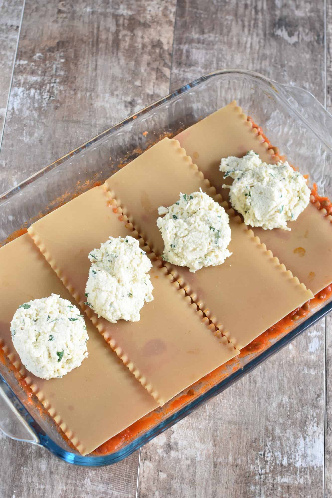 Ricotta dolloped onto each lasagna sheet