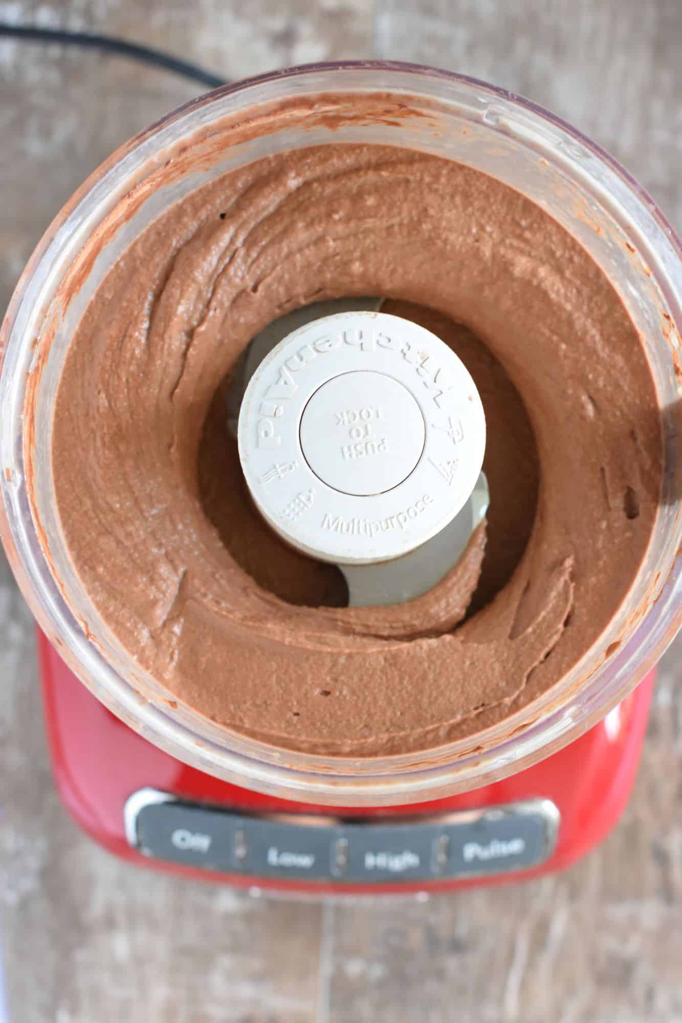 bananas, milk and cacao powder blended together in food processor