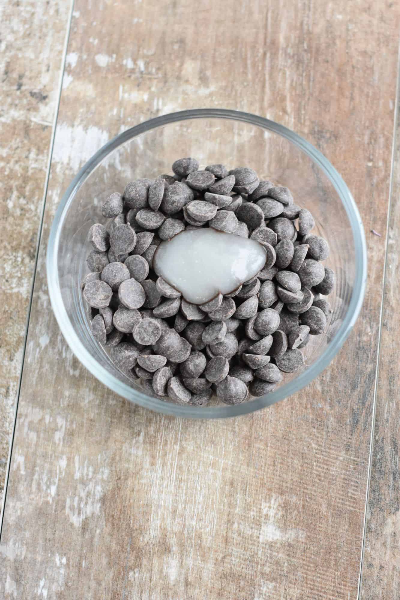 chocolate chips and coconut oil in a small glass bowl