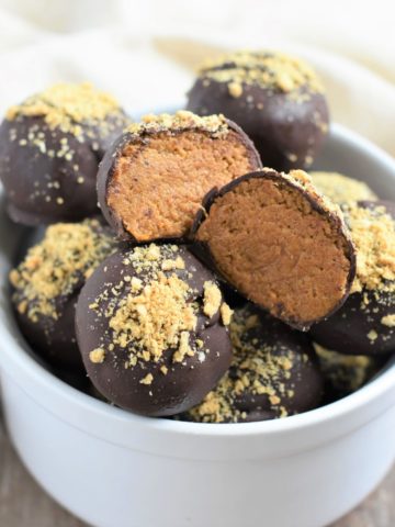 open truffle on other ones in a white bowl