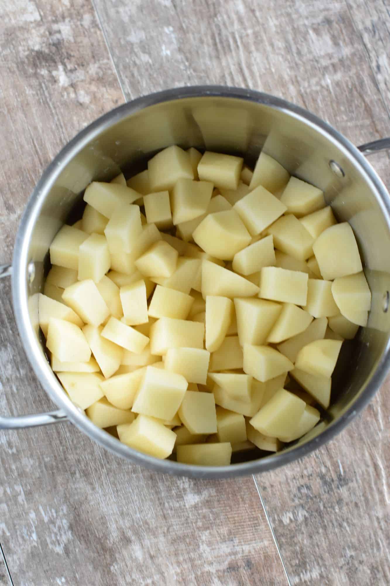 peeled and cut potatoes in a pot