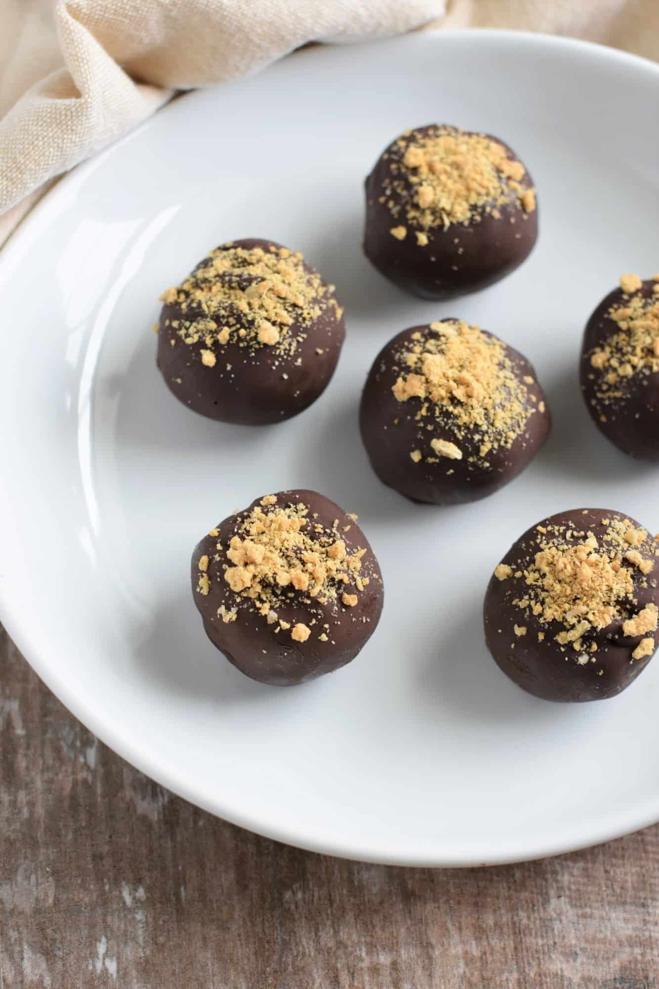 pumpkin pie truffles on a white plate