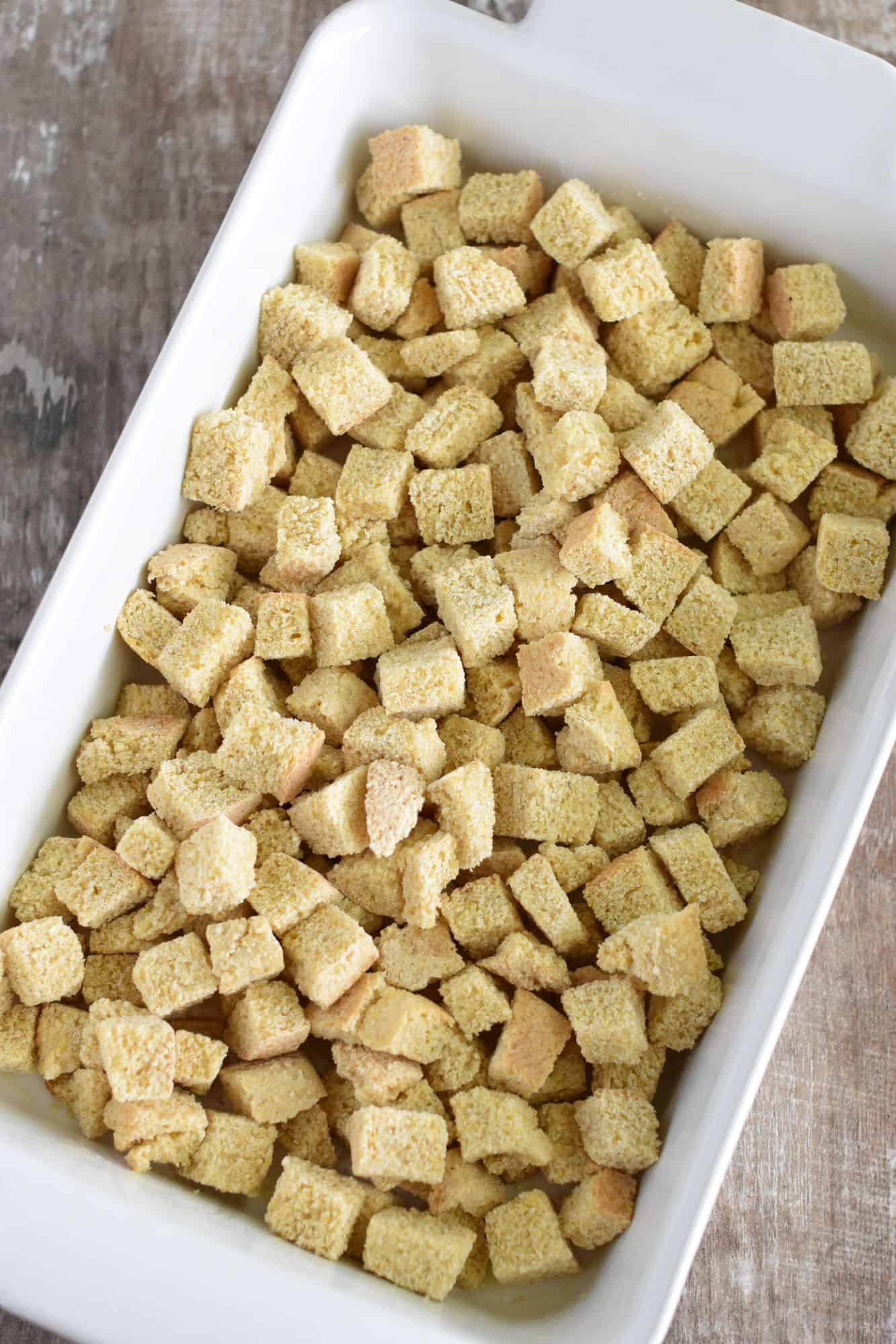 toasted bread cubes added to casserole dish