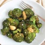 overhead of broccoli garnished with coarse sea salt