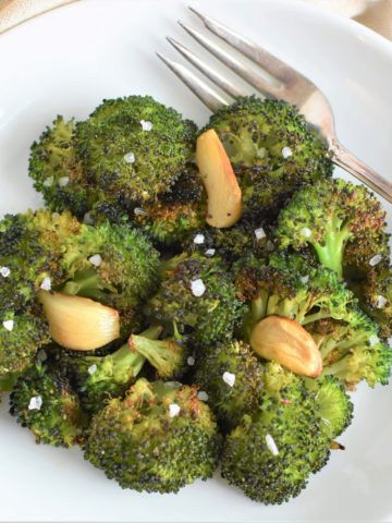 overhead of broccoli garnished with coarse sea salt