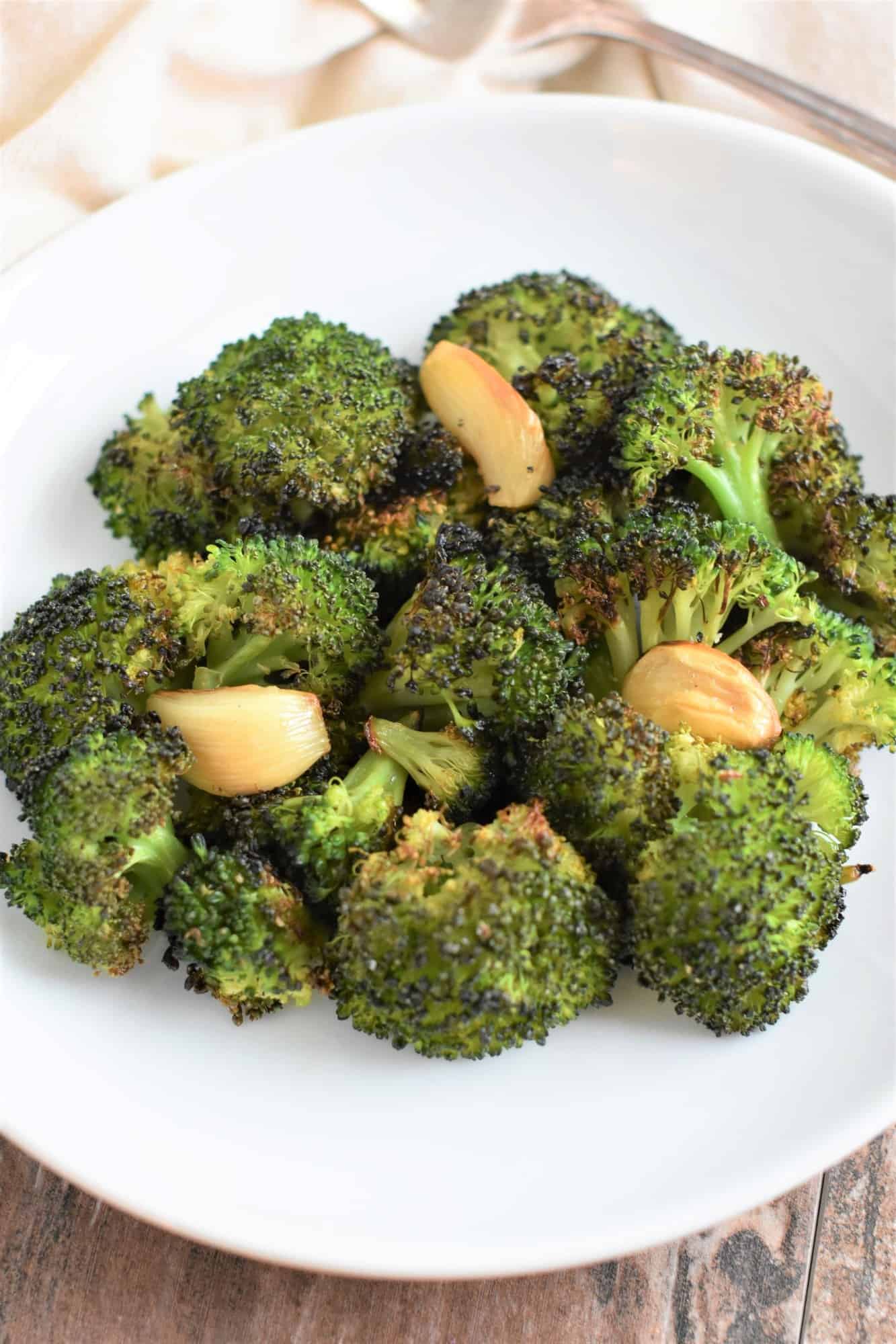 broccoli and garlic on white plate