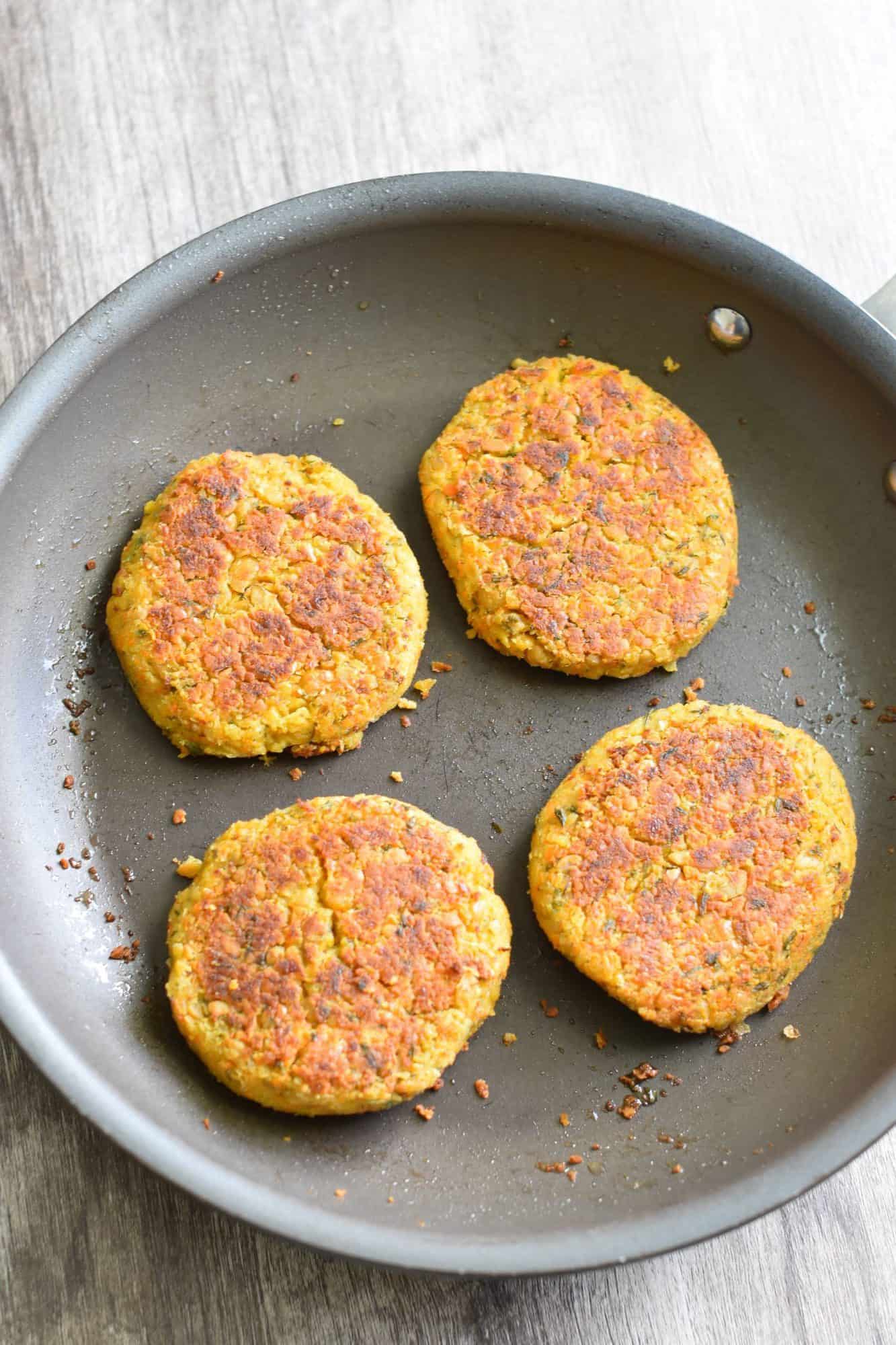 cooked burgers in skillet