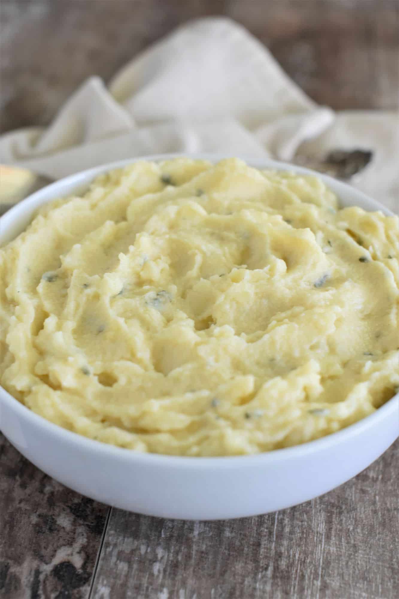 front view of mashed potatoes in white bowl