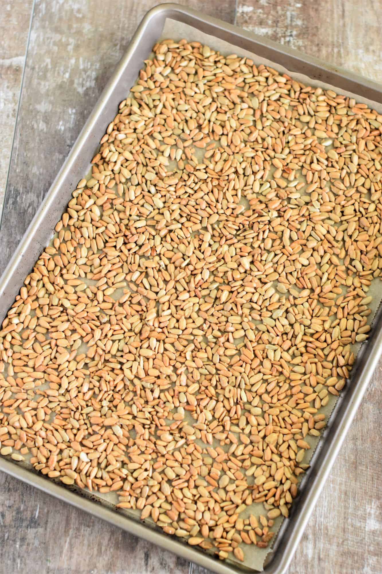 roasted seeds on baking sheet