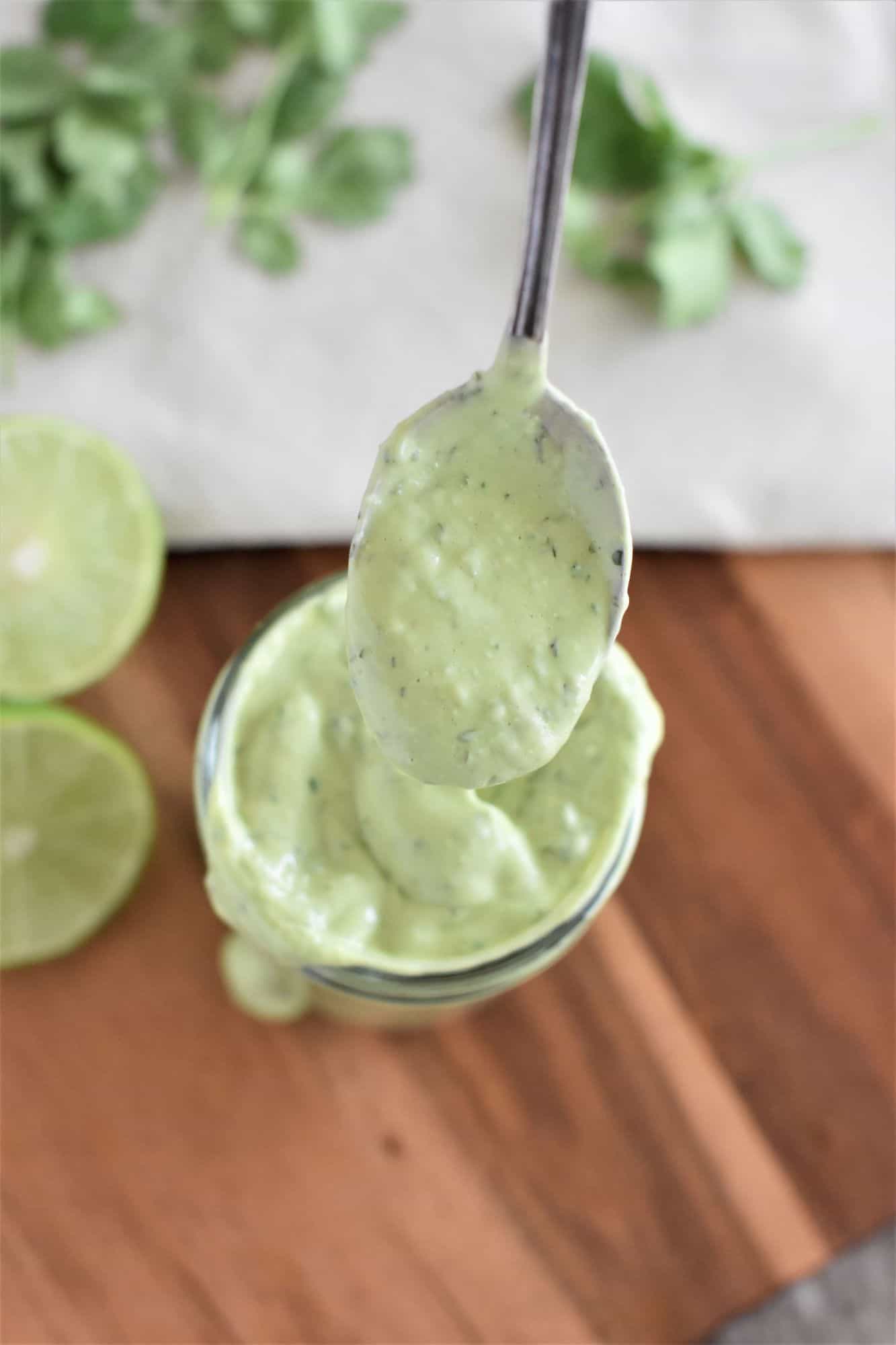 spoon of dressing over the jar of the rest